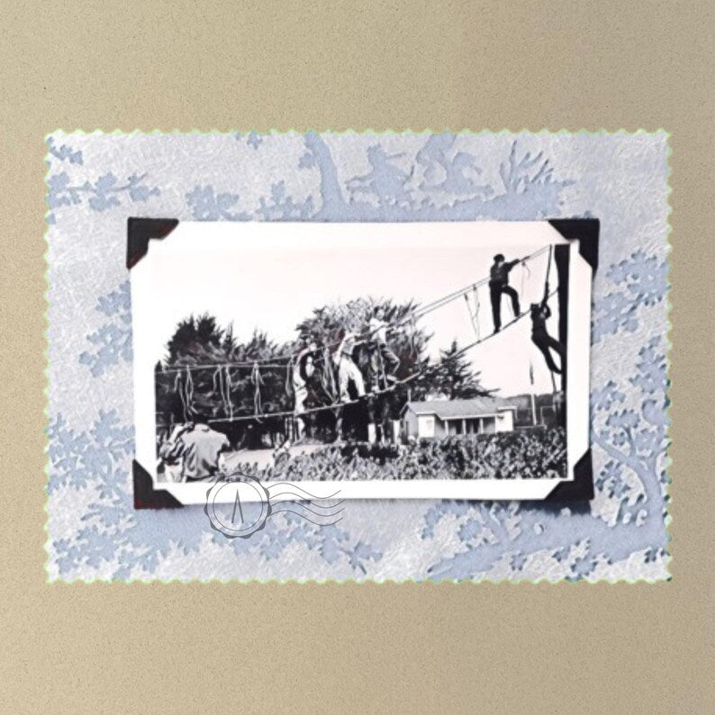 T-shirt front of vintage photo of kids playing on suspended rope ladders.