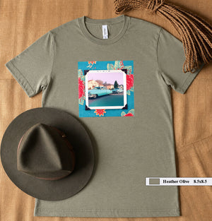 A hat and  t-shirt with a patch on the front of a large vintage photo of two classic 50's cars.