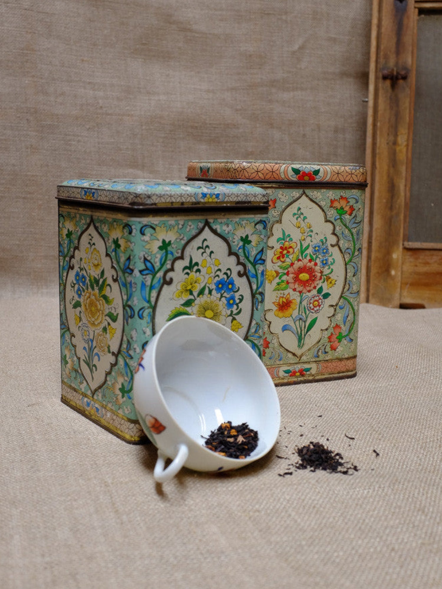 Vintage tea tins with floral patterns