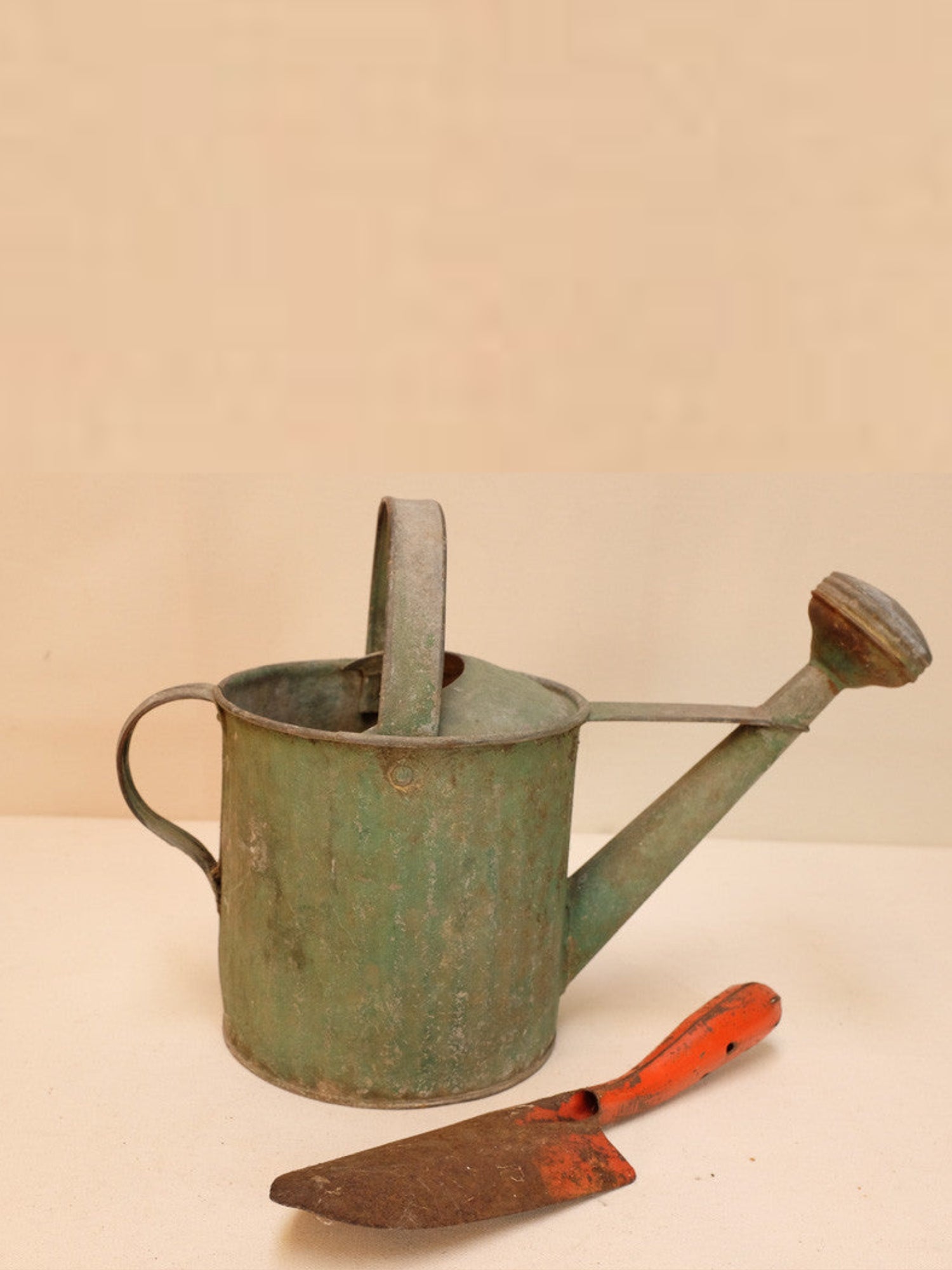 Rusty Watering Can and Shovel
