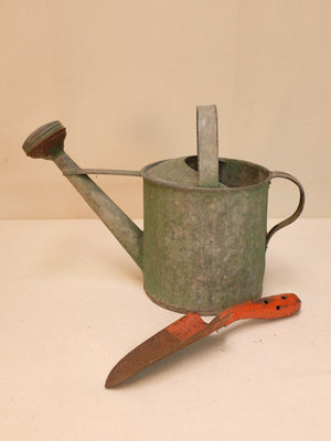 Rusty Watering Can and Shovel