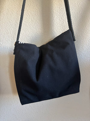 Back of a wool bag made from a vintage sailor bag.