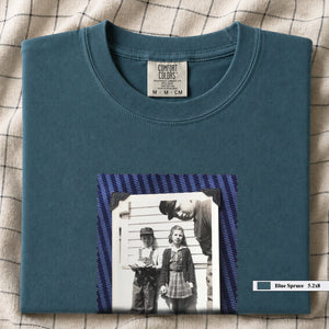 Blue Spruce colored folded t-shirt with small black and white vintage 1920's photo of kids posing for a shot