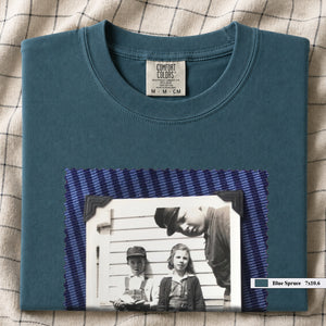 Blue spruce colored folded t-shirt with large black and white vintage 1920's photo of kids posing for a shot