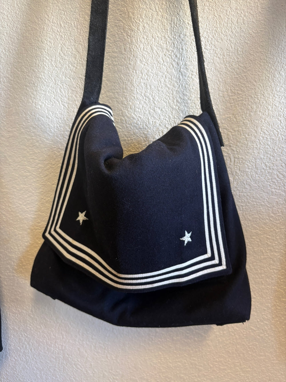 A hanging vintage US Navy collar handmade bag
