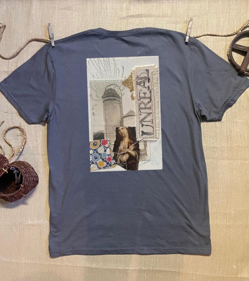Collage art t-shirt with image on back  titled 'Unreal'
