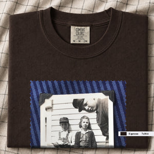 Espresso colored folded t-shirt with large black and white vintage 1920's photo of kids posing for a shot