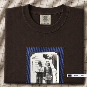 Espresso colored folded t-shirt with small black and white vintage 1920's photo of kids posing for a shot