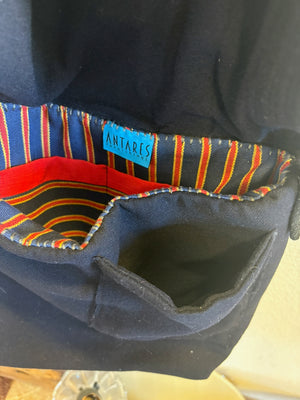 Detail of a phone pocket on the exteriopr of a handmade vintage US Navy sailor collar bag
