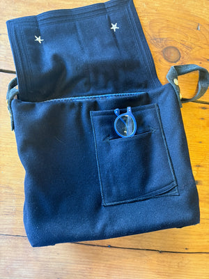 Front pockets under the sailor collar flap of a handmade bag