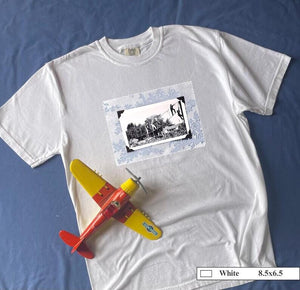 T-shirt front of vintage photo of kids playing on suspended rope ladders.