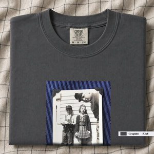 Graphite colored folded t-shirt with small black and white vintage 1920's photo of kids posing for a shot