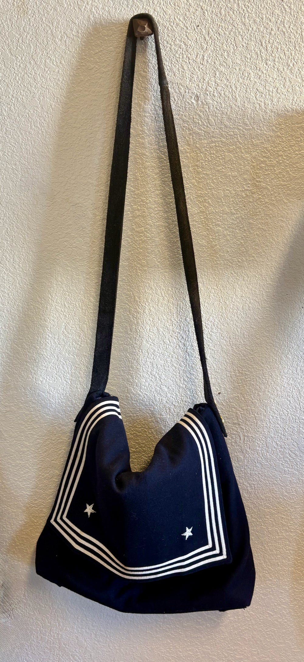 A hanging vintage US Navy collar handmade bag