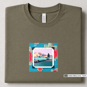 Heather Military Green colored folded t-shirt with a vintage photo of two classic 50's cars on the street. Photo is surrounded by floral fabric.