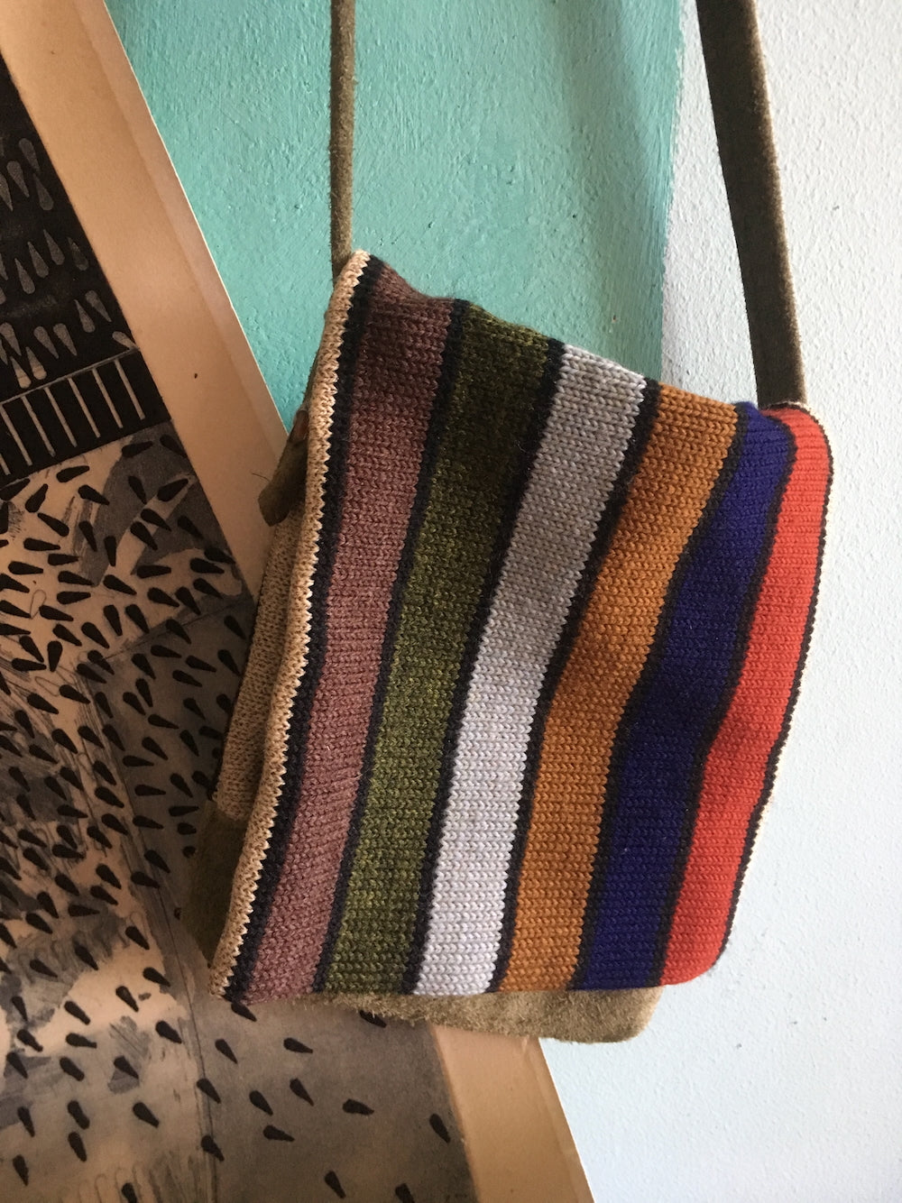 Striped vintage blanket and suede shoulder bag front