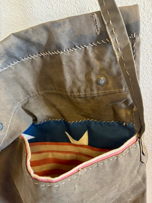 Details of hand stitching on authentic canvas, from a US army handmade bag