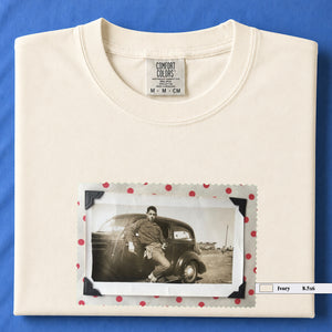 Ivory colored folded t-shirt with a vintage 1930's snapshot of a boy and his holster in front of an old car.