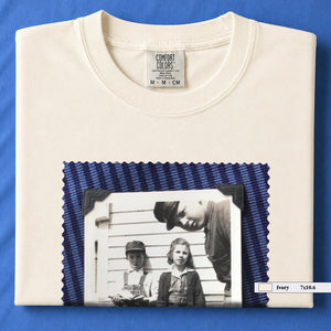 Ivory colored folded t-shirt with large black and white vintage 1920's photo of kids posing for a shot