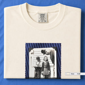 Ivory colored folded t-shirt with small black and white vintage 1920's photo of kids posing for a shot