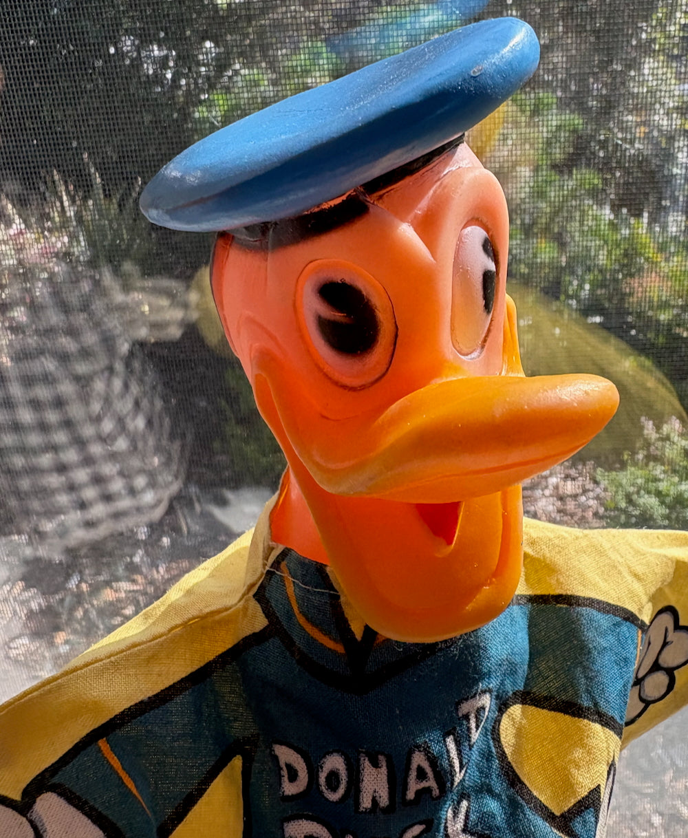 Mickey Mouse and Donald Duck Disney puppets on stands