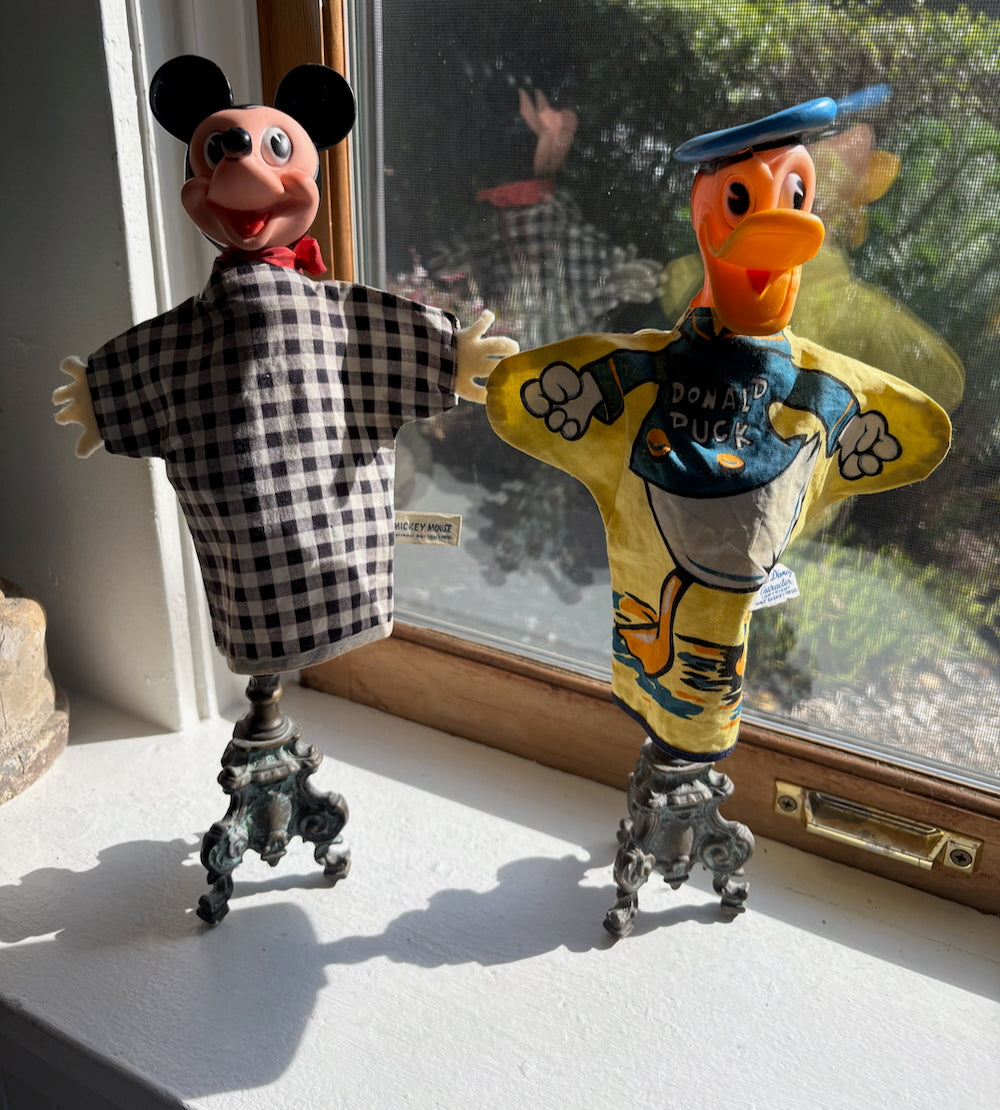 Mickey Mouse and Donald Duck Disney puppets on stands