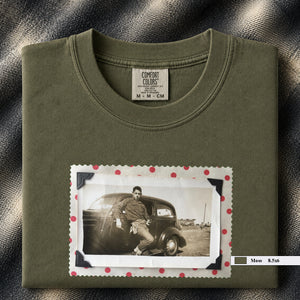 Moss colored folded t-shirt with a vintage 1930's snapshot of a boy and his holster in front of an old car.