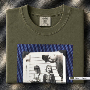 Moss colored folded t-shirt with large black and white vintage 1920's photo of kids posing for a shot