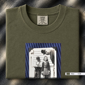 Moss colored folded t-shirt with small black and white vintage 1920's photo of kids posing for a shot