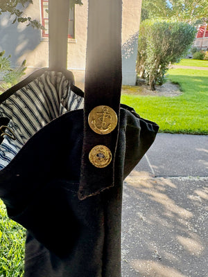 Detail of Navy buttons on a handmade bag made of navy pants.
