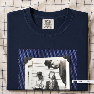 Navy colored folded t-shirt with large black and white vintage 1920's photo of kids posing for a shot