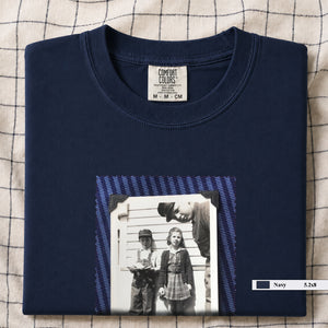 Navy colored folded t-shirt with small black and white vintage 1920's photo of kids posing for a shot