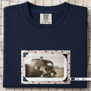 Navy folded t-shirt with a vintage 1930's snapshot of a boy and his holster in front of an old car.
