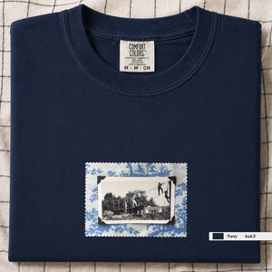 Navy folded tshirt with small vintage photo of kids playing in trees on front of shirt