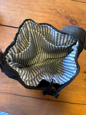 The interior of this vintage navy pant bag has two large pockets.