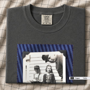 Pepper colored folded t-shirt with large black and white vintage 1920's photo of kids posing for a shot
