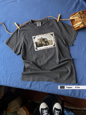 A Pepper t-shirt with a polka dot framed vintage photo of a boy and his holster in front of an old car