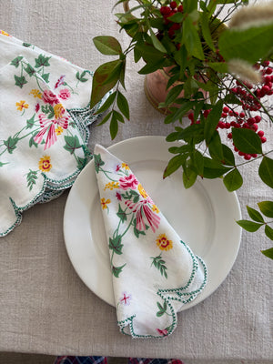 Vintage cloth napkin with scallop edge on plate