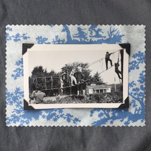 Vintage photo of kids playing mounted on a blue print fabric