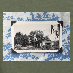 Vintage photo of kids playing mounted on a blue print fabric
