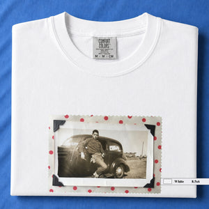 White colored folded t-shirt with a vintage 1930's snapshot of a boy and his holster in front of an old car.