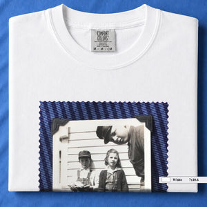 White colored folded t-shirt with large black and white vintage 1920's photo of kids posing for a shot