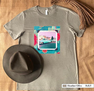 A hat and t-shirt with a vintage photo of two classic 50's cars on the street. Photo is surrounded by floral fabric.