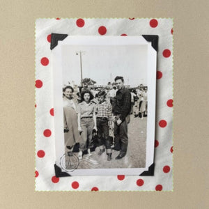 This polka dot border surrounds a vintage photo of a family at the fair