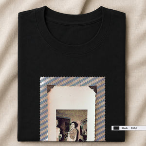 Black folded t-shirt with large vintage photo of lady screaming