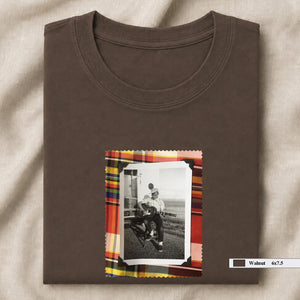brown folded tee shirt with small vintage photo of guitar player on front
