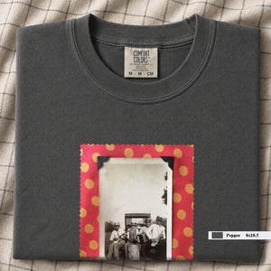 Charcoal colored folded t-shirt with large vintage photo of musicians playing