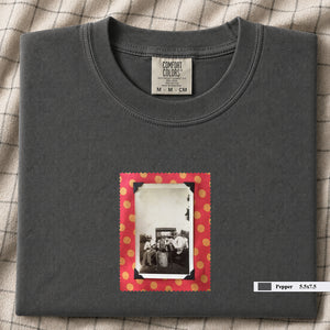 Charcoal colored folded t-shirt with small vintage photo of musicians playing