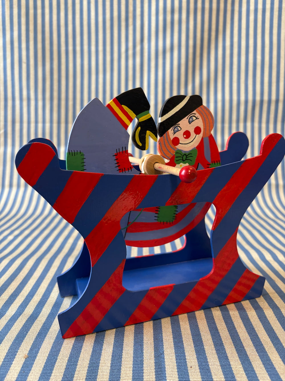 Spinning clown toy angle view