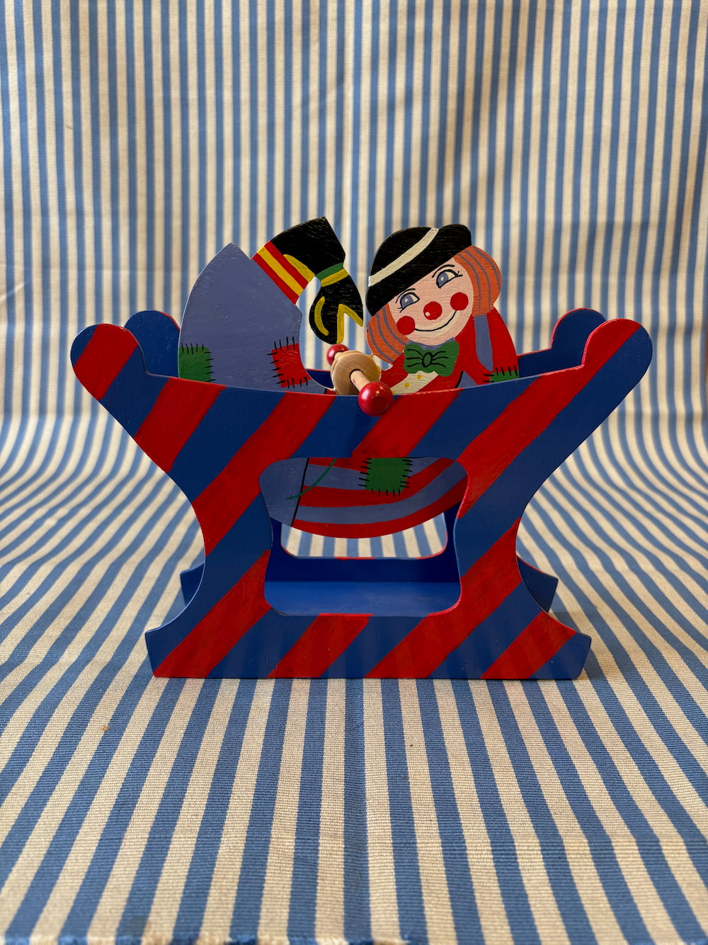 Spinning clown toy angle view