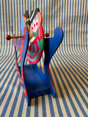 Spinning clown toy side view